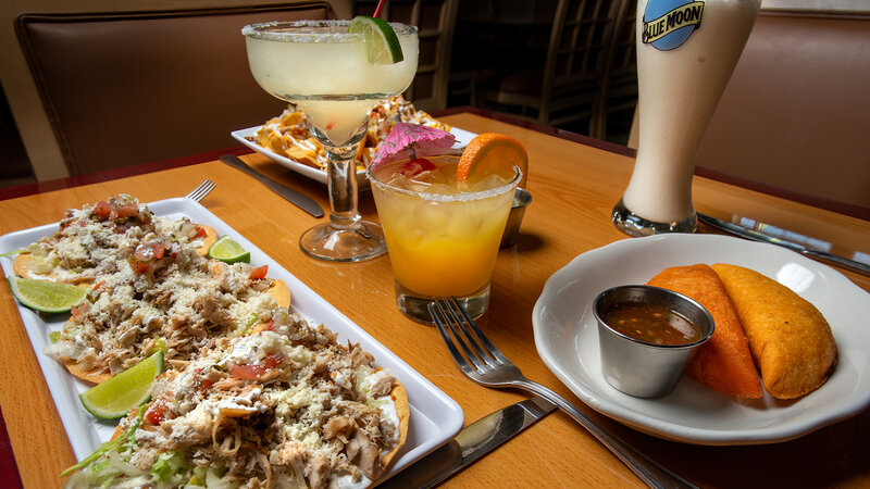Multiple appetizers with cocktails