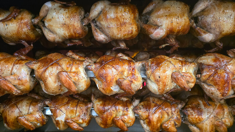 Chicken cooking on rotisserie