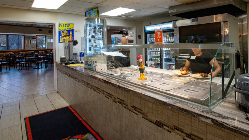 Takeout counter with employee preparing food