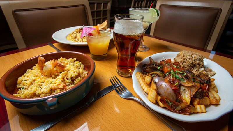 Three entrees with a pint of beer and cocktail